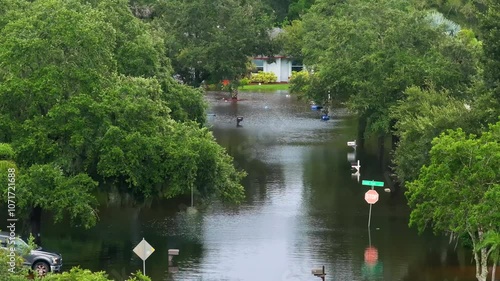 Flooded residential area with underwater houses from hurricane rainfall water in Florida suburban community. Aftermath of natural disaster in southern USA. photo