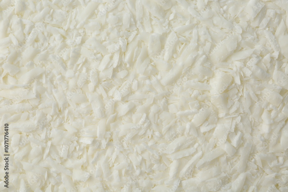 White soy wax flakes as background, closeup White soy wax flakes as background, closeup