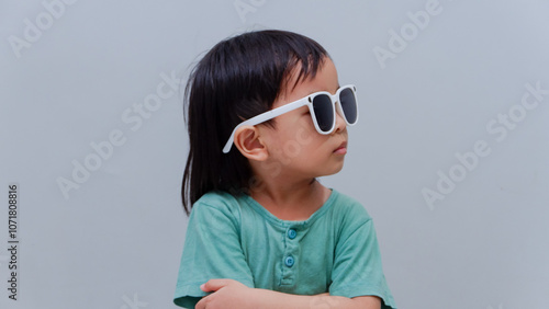 cute young Asian toddler pose with eyewear