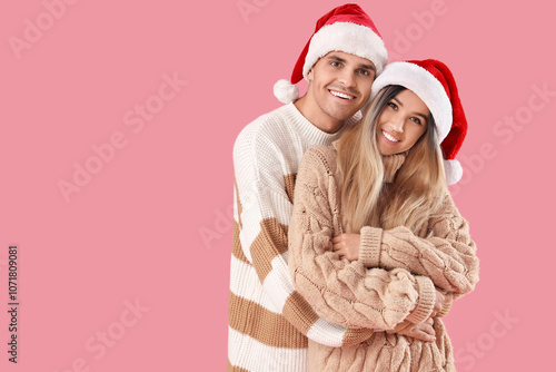 Happy young couple in Santa...