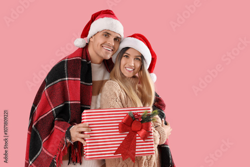 Happy young couple in Santa...