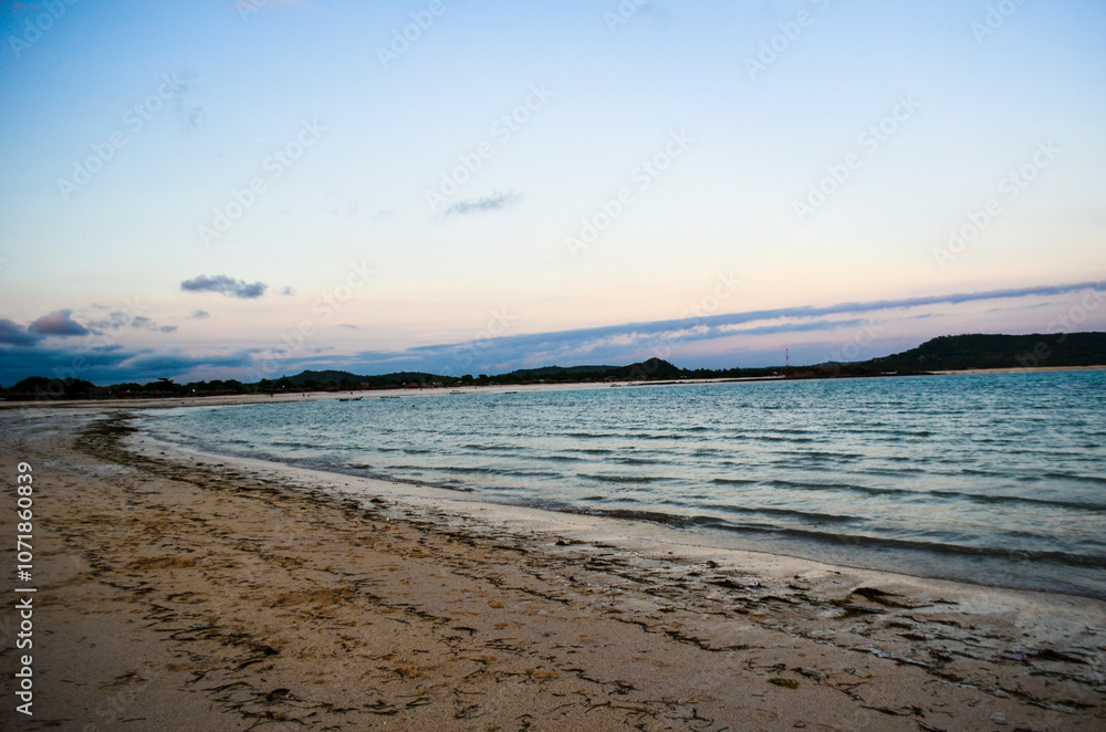 Obraz premium Beautiful sunset with orange sky color and very beautiful on Senggigi Beach, Lombok