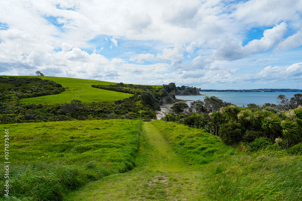 Serene Coastal Landscape with Lush Green Hills and Tranquil Beach, Capturing the Beauty of Nature and Expansive Sky in a Peaceful Atmosphere Serene Coastal Landscape with Lush Green Hills and Tranquil Beach, Capturing the Beauty of Nature and Expansive Sky in a Peaceful Atmosphere