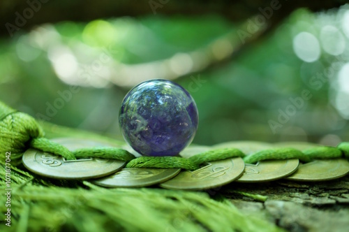 Rose quartz amethyst ball and Chinese coins. Fortune telling and horoscope. photo