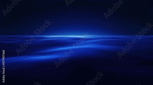Serene ocean waves under a deep blue twilight sky, creating a tranquil and calming atmosphere.