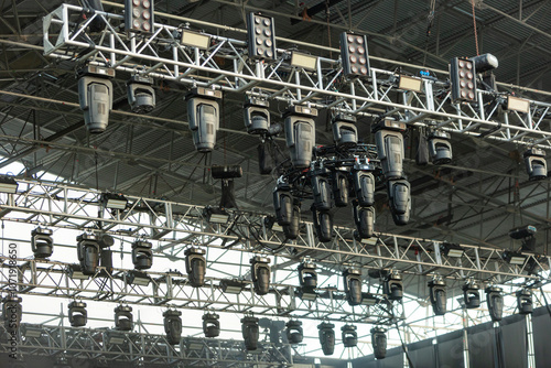 Design of spotlights hanging on the ceiling of the stage at a music festival