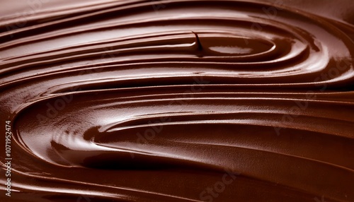 Rich creamy melted chocolate swirl texture. luscious, artistic curves create indulgence & pleasure. Brown liquid chocolatey wave background photo