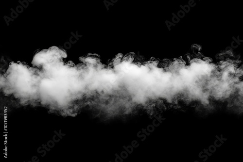 A long, white cloud of smoke is floating in the air