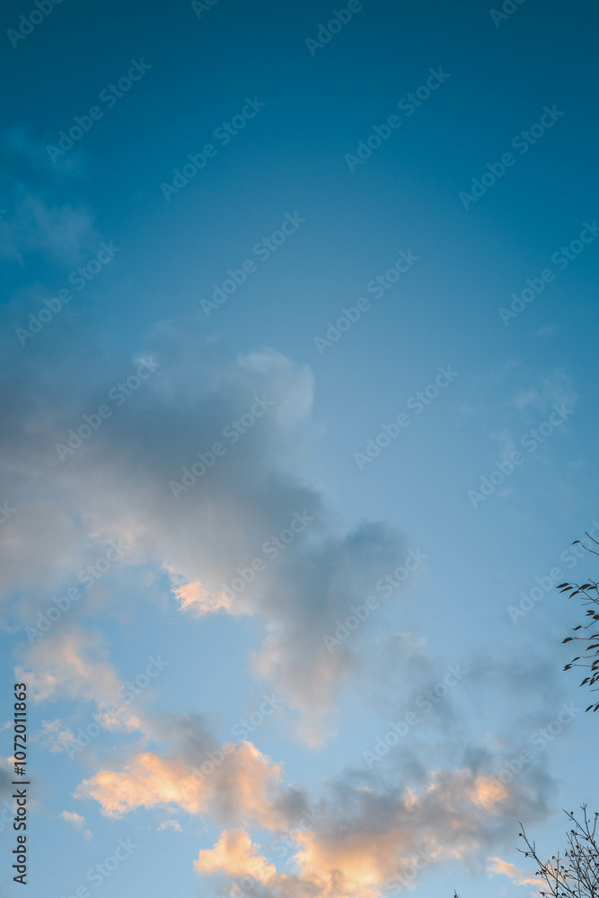Clear blue sky with scattered soft clouds, featuring gentle gradients of color transitioning to a serene, tranquil atmosphere, perfect as a background or for nature-themed concepts Clear blue sky with scattered soft clouds, featuring gentle gradients of color transitioning to a serene, tranquil atmosphere, perfect as a background or for nature-themed concepts