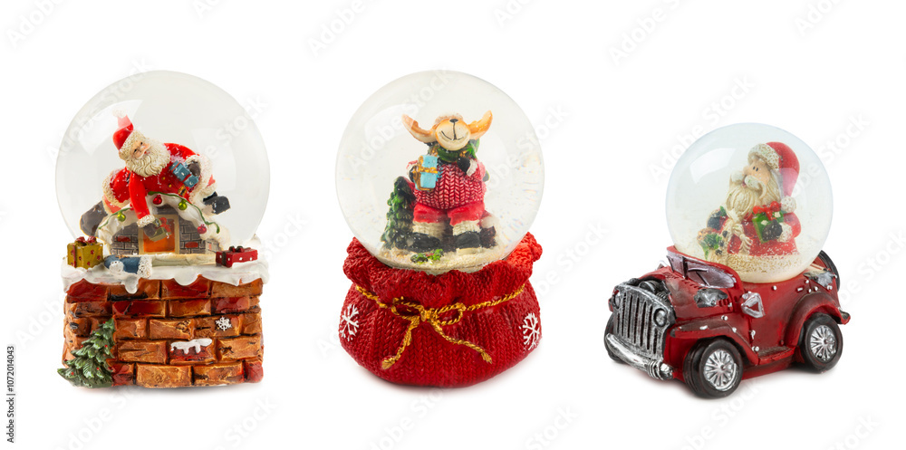 Fototapeta premium Beautiful snow globe isolated on white background. Christmas snow globe.Christmas balls. Christmas and New Year holiday concept. Gift close-up