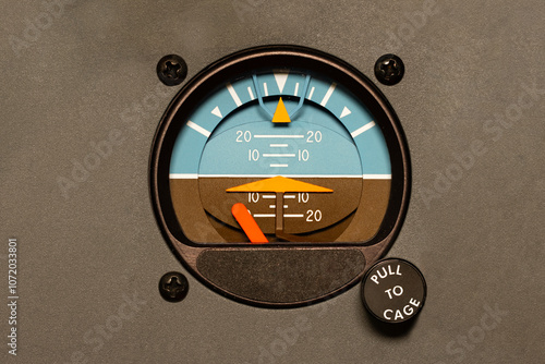 Attitude Indicator. An aerospace instrument for determining orientation of an aircraft in flight. Displays roll, pitch, and bank angles. Aviation safety with analog dials