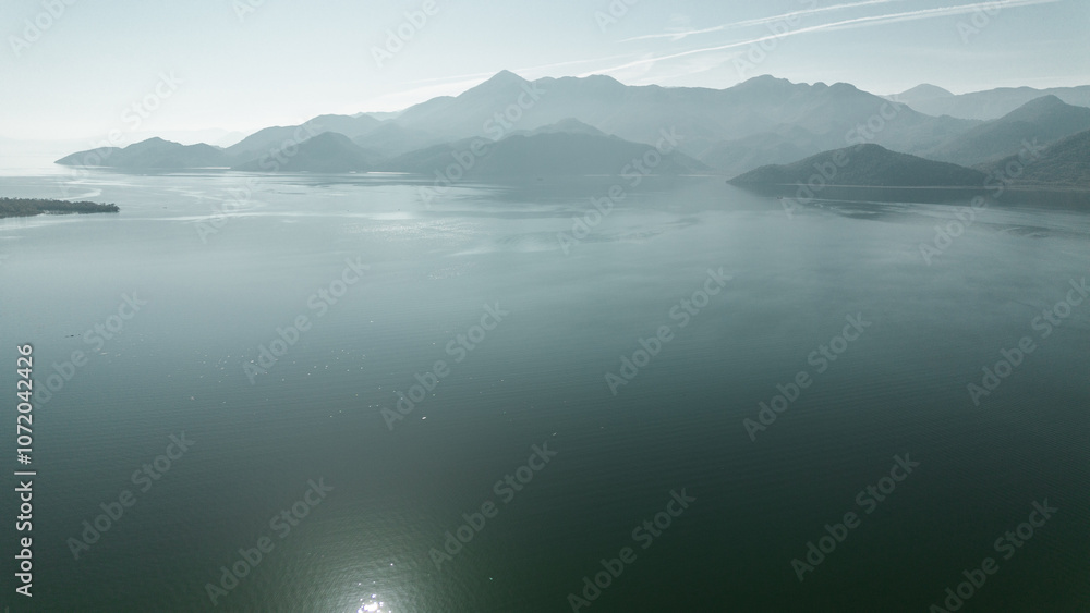 Aerial view of Skadar Lake on a warm sunny autumn day. The National Park in Montenegro. A breathtaking natural landscape from a bird's-eye view. Aerial view of Skadar Lake on a warm sunny autumn day. The National Park in Montenegro. A breathtaking natural landscape from a bird's-eye view.
