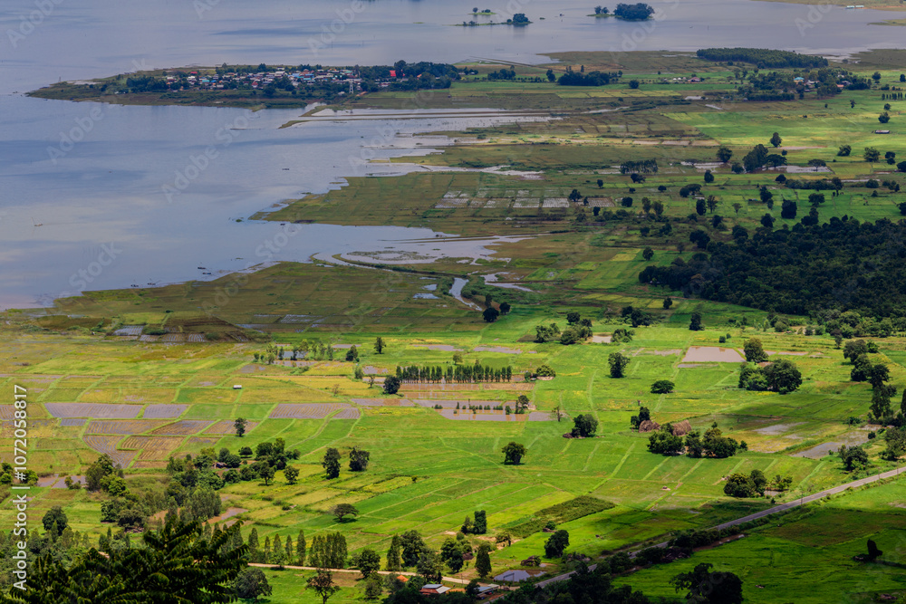 Obraz premium Panoramic nature background from a viewpoint on a high mountain overlooking the scenery below, river, road, rocks, trees, the beauty of nature during a trip in Khon Kaen, Thailand.