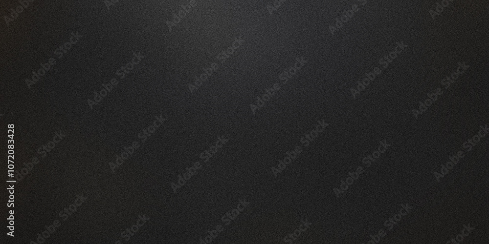 Subtle light effect illuminates center of dark, grainy background, creating a textured and atmospheric backdrop Subtle light effect illuminates center of dark, grainy background, creating a textured and atmospheric backdrop