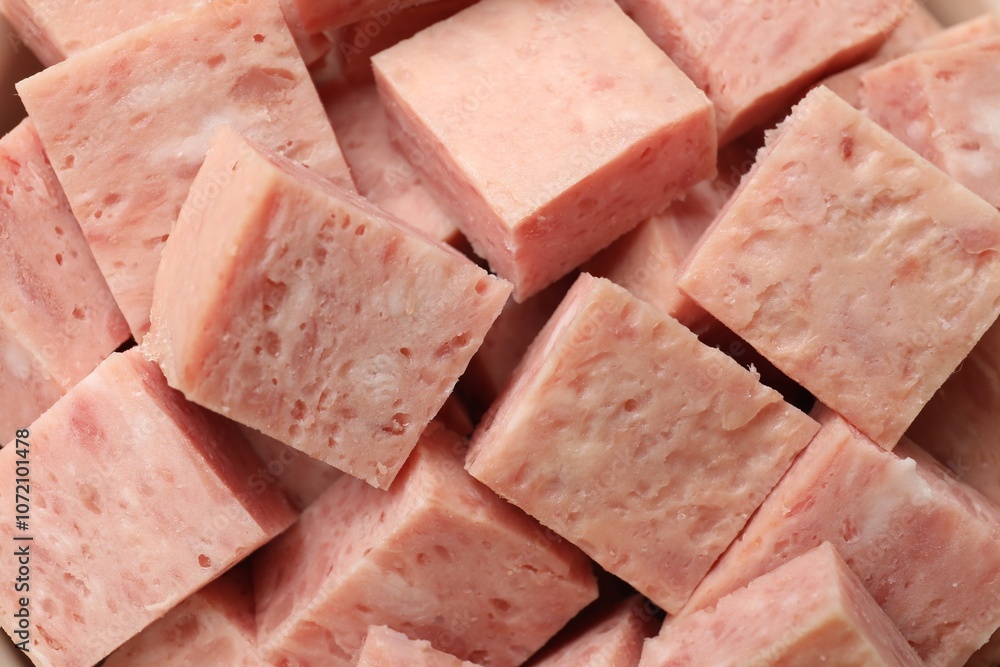 Pieces of canned meat as background, closeup Pieces of canned meat as background, closeup