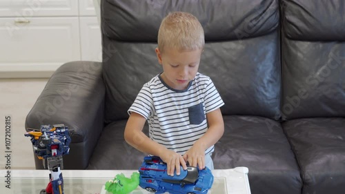 child playing with robot transformer toy photo