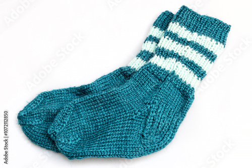 Warm, woolen knitted socks isolated on white background. Warm socks made of wool for winter season. 