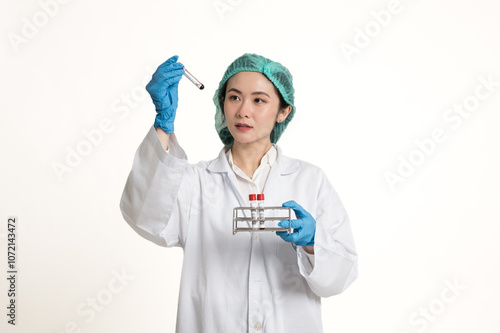 Portrait of Asian woman diagnostic laboratory scientist wear blue gloves holding blood test tube copy space workplace isolated on white background.Laboratory equipment and medical treatment concept.