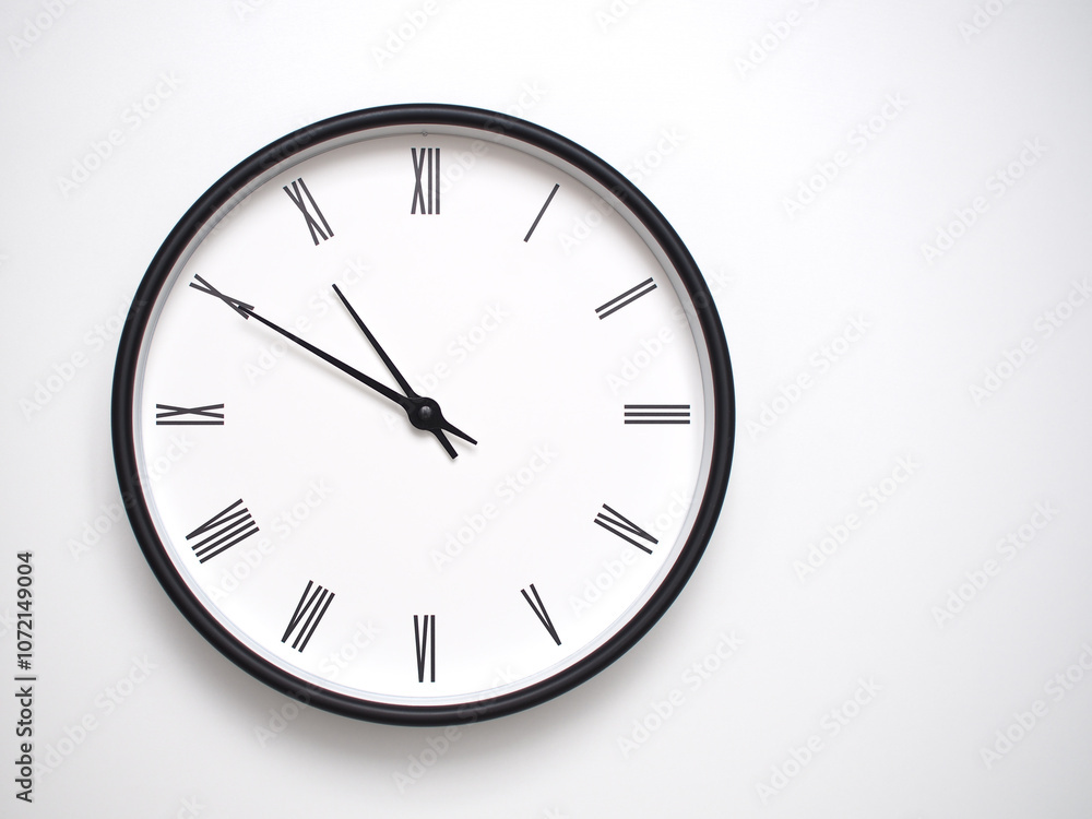 Clock Showing 22.50/10.50 with Roman Numerals – Simple Round Clock for Concepts of Time Management and Scheduling. Clock Showing 22.50/10.50 with Roman Numerals – Simple Round Clock for Concepts of Time Management and Scheduling.