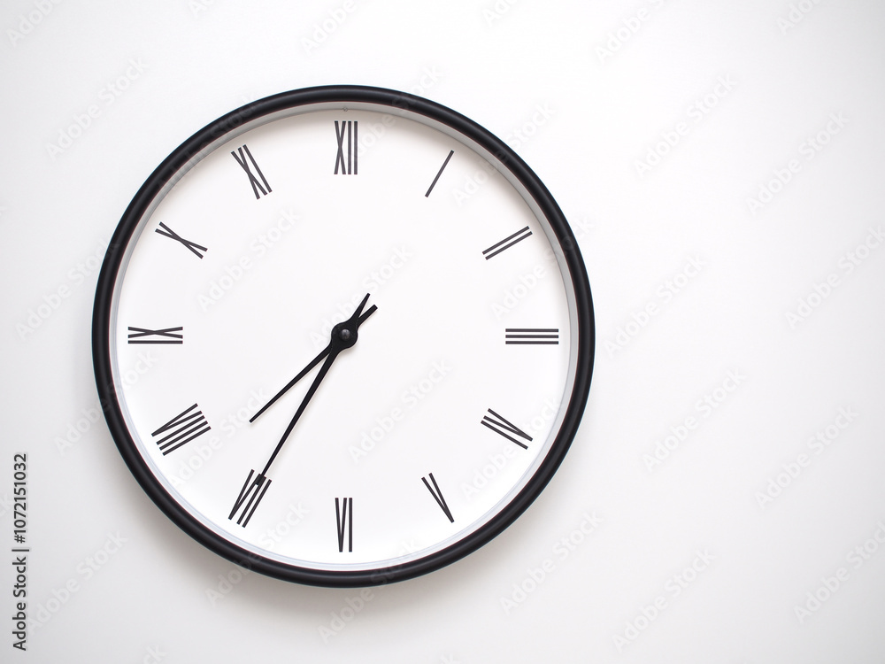 Clock Showing 19.35/07.35 with Roman Numerals – Simple Round Clock for Concepts of Time Management and Scheduling. Clock Showing 19.35/07.35 with Roman Numerals – Simple Round Clock for Concepts of Time Management and Scheduling.