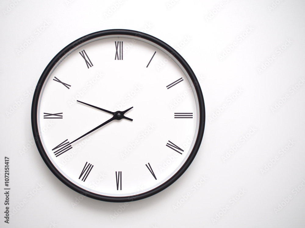 Clock Showing 21.40 or 09.40 with Roman Numerals – Simple Round Clock for Concepts of Time Management and Scheduling. Clock Showing 21.40 or 09.40 with Roman Numerals – Simple Round Clock for Concepts of Time Management and Scheduling.