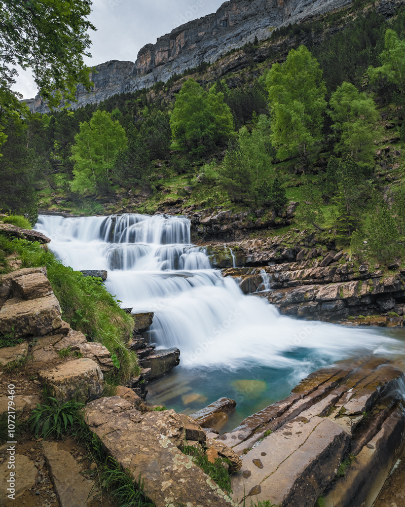 Fototapeta premium Gradas de Soaso backwater Ordesa y Monte Perdido National Park is in the north of the Iberian Peninsula, nestled in the center of the Pyrenean mountain range, in the Autonomous Community of Aragon. To