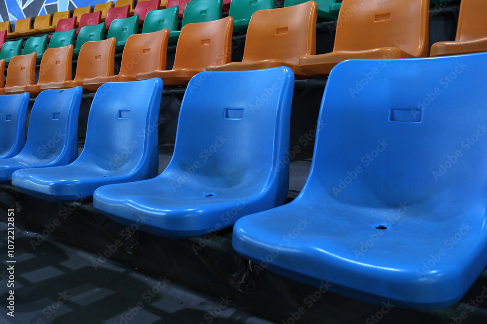 Naklejka premium Photo of the colorful benches in a sports hall in the stands