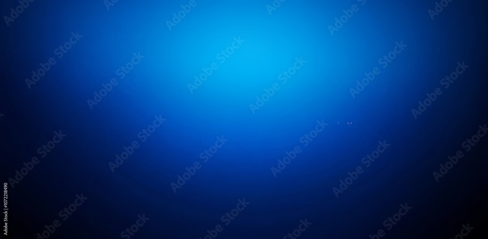 Obraz premium A Deep Blue Gradient Background With Subtle Light Specks