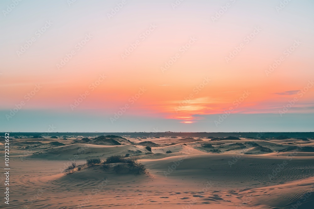 a sunrise over a desert landscape. a sunrise over a desert landscape.