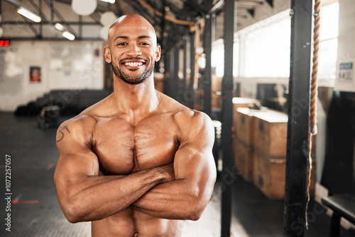 Portrait, fitness and happy man with arms crossed for body health, muscle or workout with pride in sports gym. Face, shirtless or confident bodybuilder, strong athlete or smile for exercise in Brazil