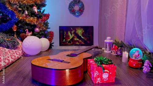 Guitar by the Fireplace with a Christmas Tree and Ornaments. Cozy New Year and Christmas Scene Blending Music and Festive Holiday Decor.