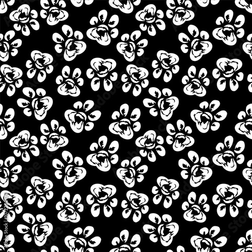 A playful and charming seamless pattern featuring cat paw prints on a sleek black background