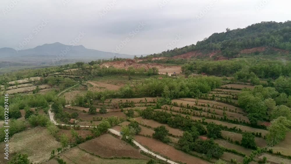 Aerial view of a green mountain full of trees. Beautiful hills seen from above using a drone. Aerial view of a green mountain full of trees. Beautiful hills seen from above using a drone.