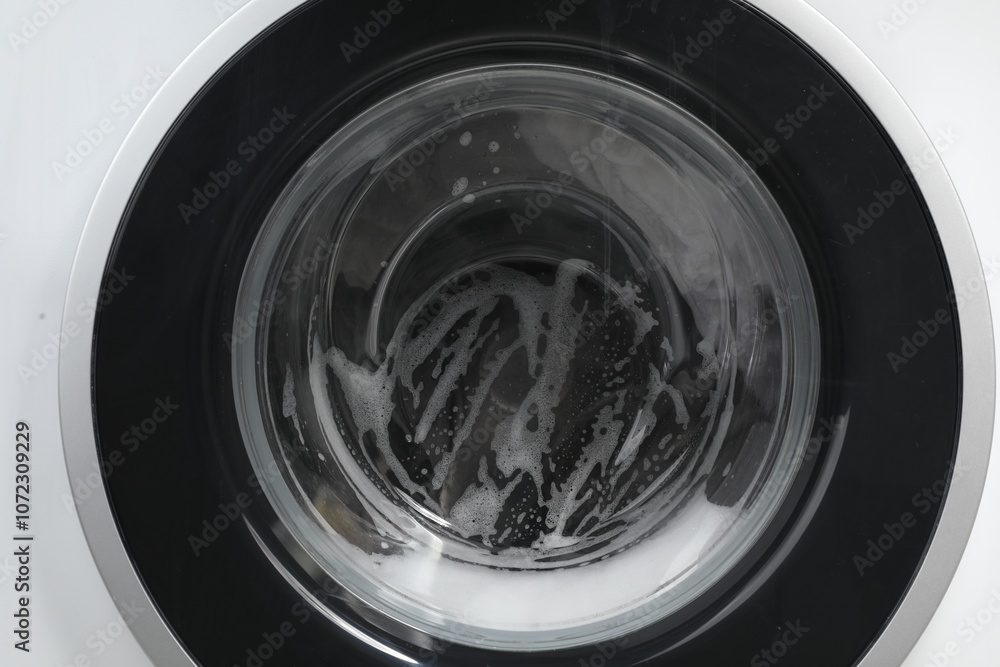 Washing machine with suds as background, closeup Washing machine with suds as background, closeup