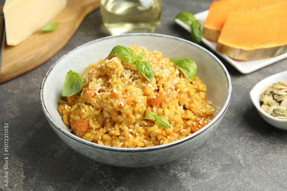 Delicious pumpkin risotto on grey table, closeup Delicious pumpkin risotto on grey table, closeup