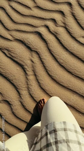 Experience the Tranquil Beauty of Sand Patterns and Enjoying Barefoot Serenity by the Seaside