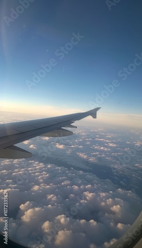 A serene air travel perspective  captivating view from a plane window with bright blue sky photo