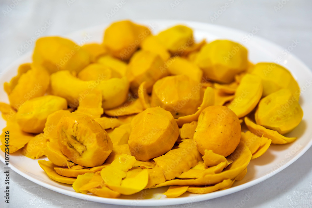 Traditional and exotic Brazilian dish rice, chicken and pequi (caryocar brasileinse) 