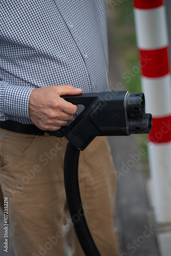 Electric Vehicle Charger in Hand