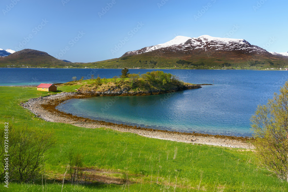 Norway islands. Arctic polar landscape with mountains and fjord in summer. Norway islands. Arctic polar landscape with mountains and fjord in summer.