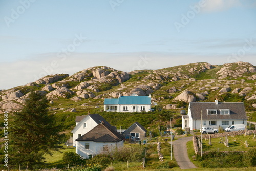 house in a small scottish village on the hill with a blue roof