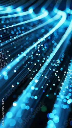 Abstract blue fiber optic lights in motion, glowing technology concept