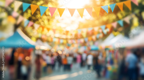 Blurred Festive Street Market with Colorful Flags and Sunlight