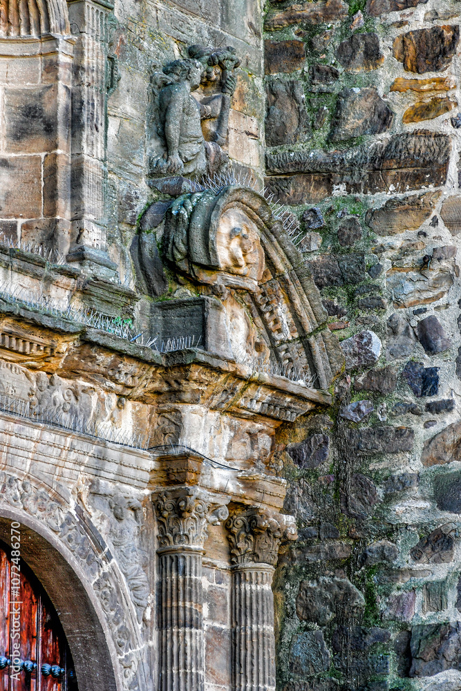 Obraz premium Image of the Cardinal Virtue of the Fortress. Detail of the north facade of the Church of the Assumption in Puertollano, Ciudad Real Province, Spain