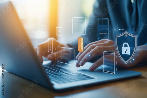 Close-up of hands typing on a laptop with digital security graphics overlay, symbolizing data protection and cyber security in a modern tech environment. photo