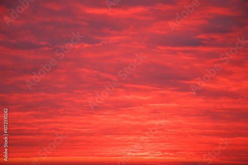 vibrant sunrise sky with pink clouds