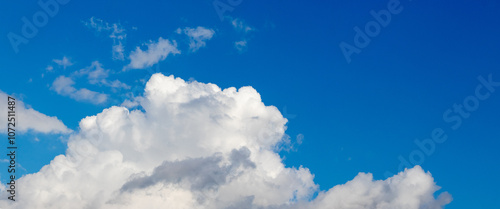 white curly cloud in blue sky sunny weather