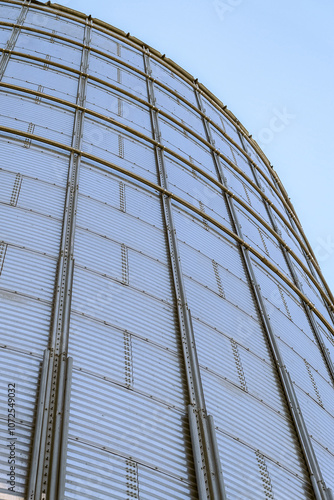 Detail of galvanized grain bin with wind reinforcing ring belts photo