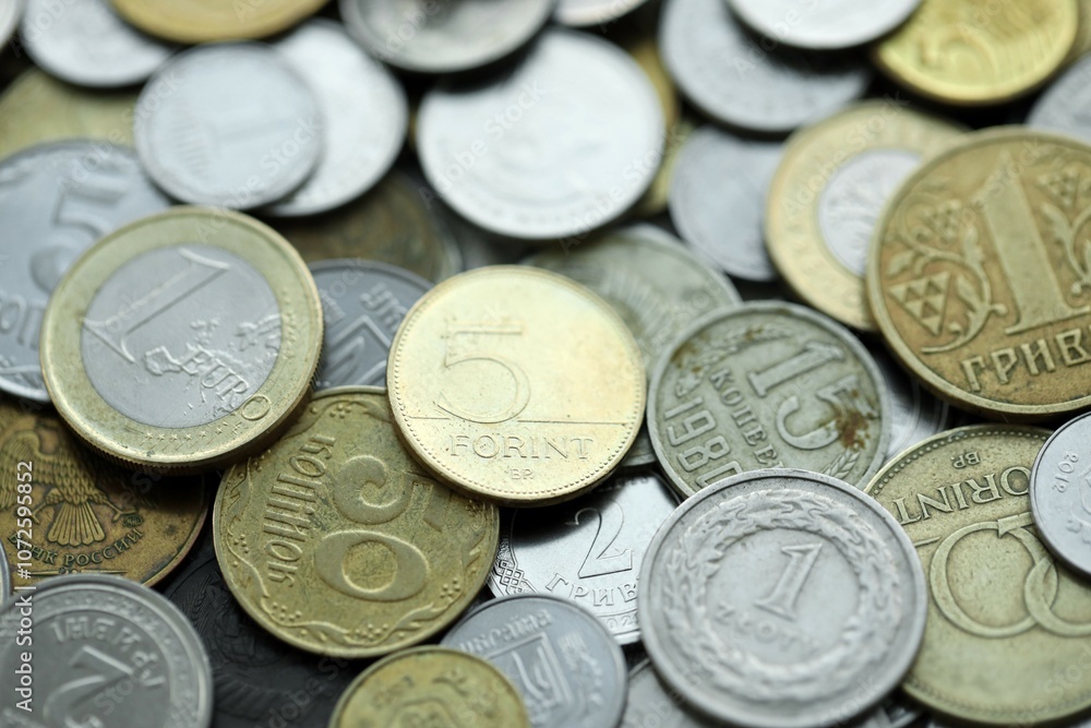 Big pile of different coins from various currencies and different countries around the world. Currency exchange Big pile of different coins from various currencies and different countries around the world. Currency exchange