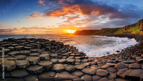 dramatic sunset at the giant s causeway in northern ireland uk photo